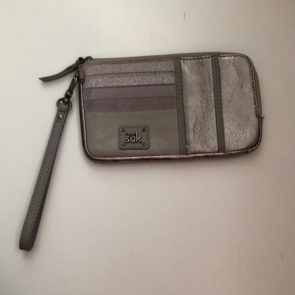 The sak wristlet gray metallic in color